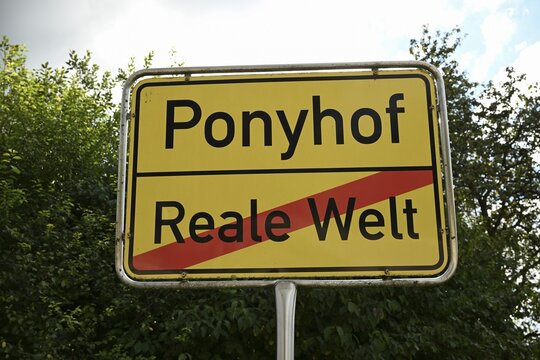 Pony farm versus real world sign, Baden-W&uuml;rttemberg, Germany