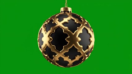 An ornate black and gold Christmas bauble with a detailed filigree pattern hanging against a solid green screen. - Powered by Adobe