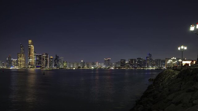 night time illumination abu dhabi city famous downtown front bay panorama timelapse 4k united arab emirates   