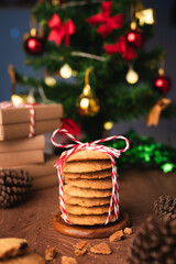 Handmade cookies wrapped with festive rope, capturing the spirit of Christmas and New Year  perfect as heartfelt gift in cozy vertical holiday photo concept.