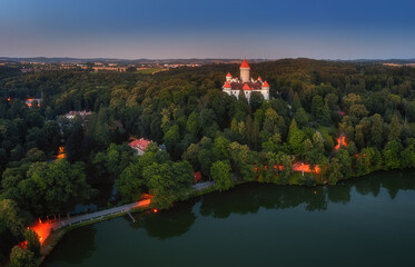 view of Konopiste Castle with lit lamps