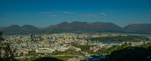 A warm, sweeping panorama of Tirana's expansive cityscape and the Artificial Lake, set against the...