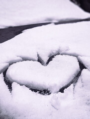heart shape drawn in white snow first snow concept romance