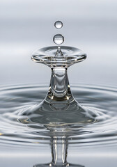 A mesmerizing shot of water droplet collision, showcasing intricate details and captivating patterns