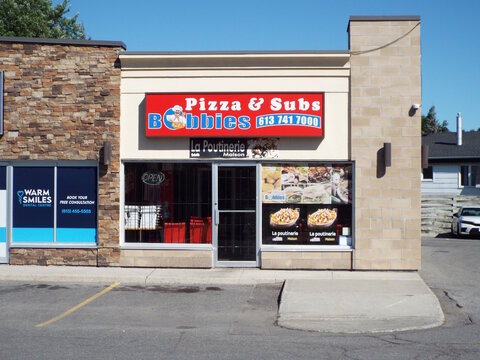  Gloucester, ON, Canada-June 26,2025:The storefront of "Bobbie's Pizza and Subs", a restaurant that also operates as La Poutinerie Maison at 1443 Ogilvie Rd.
