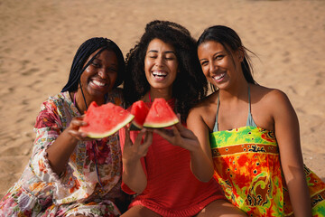 Happy group of multiracial women cheering with watermelon on the beach during travle vacation - Holiday, female friendship and young people concept
