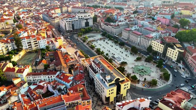 Lisbon at Sunset from Above &ndash; Drone View of Historic Rooftops, Red Palm Trees, Ocean Atmosphere and Timeless City Square