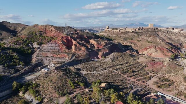 Majestic Lorca Castle Fortress and Historic City: Aerial View Overlooking the Arid Landscape of Murcia, Southern Spain