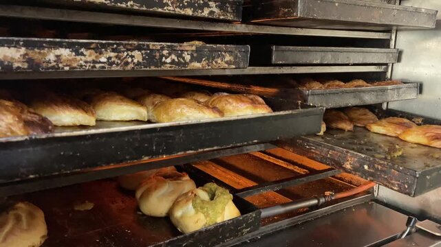 Fresh pastizzi pastries cooking in the oven
