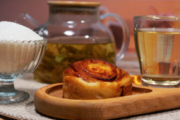 Herbal tea and pastry on wooden tray