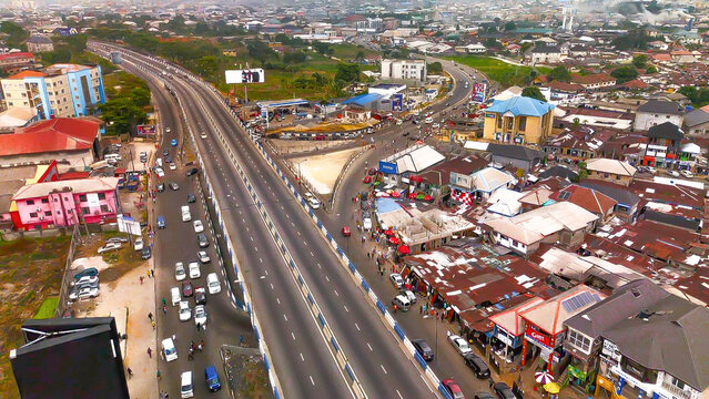 Aerial view of the Garrison Junction showing the Aba Road intersection with a flyover amidst the mix of modern buildings and traditional rooftops, Port Harcourt, Rivers State, Nigeria.