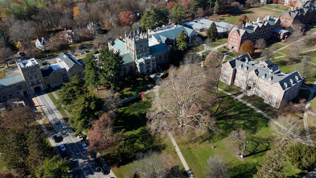 Aerial view of Vassar College's gothic architecture and autumnal foliage paints a picturesque scene in the crisp afternoon light, Poughkeepsie, New York, United States.