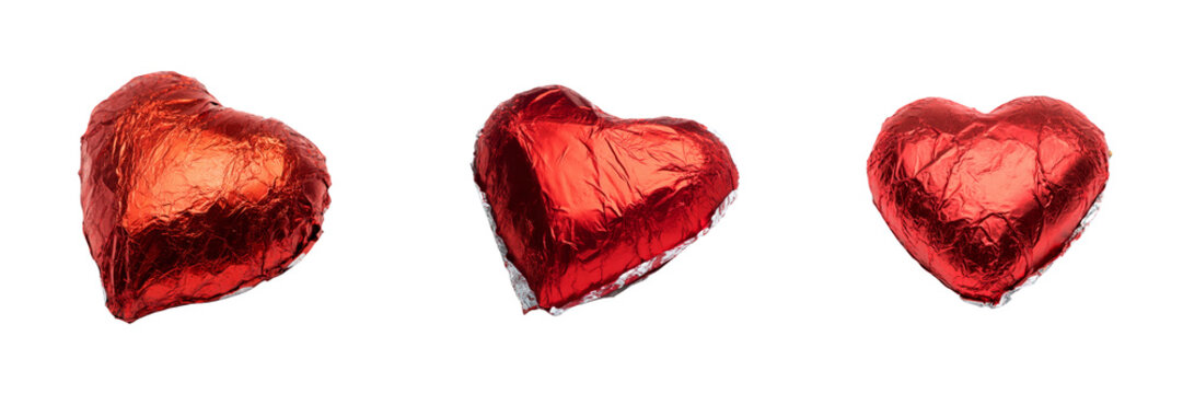 Heart-shaped foil chocolates on transparent background sweet treats food photography