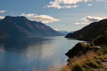Lake Pukaki, New Zealand - May 23, 2025: The striking turquoise-blue water of the glacial lake is...
