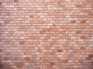 texture of Varied pink-brown brick wall