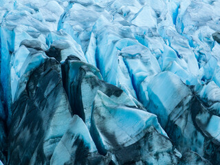 Detail of the tidewater terminus of North Sawyer Glacier at the end of Tracy Arm fjord in southeastern Alaska early in summer. (Note veins of blue ice at center. Extremely dense ice.)