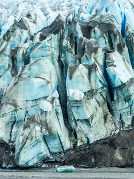 Part of the tidewater terminus of North Sawyer Glacier at the end of Tracy Arm fjord in southeastern Alaska early in summer. (Note vein of blue ice at upper right. Extremely dense ice.)