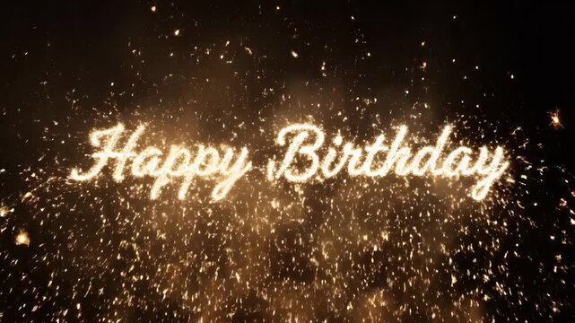 Happy Birthday text written in golden sparklers against a dark background with flying embers.