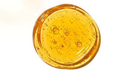 Golden viscous liquid with abundant tiny air bubbles, forming a circular shape, showing fluid texture on a white background, ideal for natural sweet product