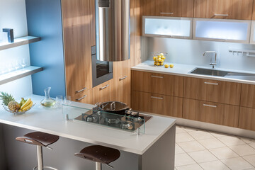 Contemporary Kitchen with Island, Fruit Bowl, and Stainless Steel Fixtures