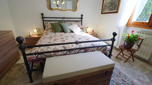 Charming old-style bedroom featuring a luxurious bed and rustic furniture