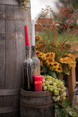 Rustic Barrel Wedding Decor With Candles, Grapes and Autumn Flowers