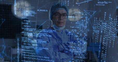 Crossing surgeon's arms in blue scrubs, cap, lowered mask and gloves at OR with holographic code