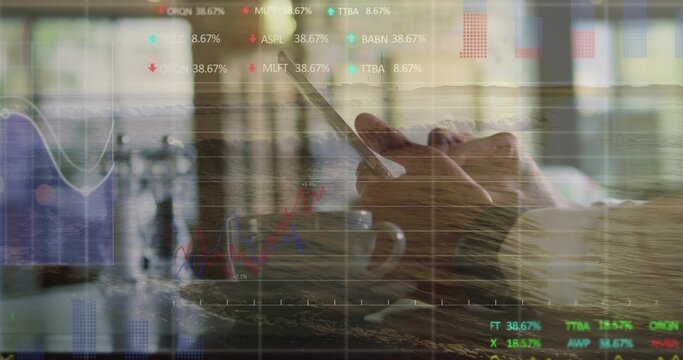 Tapping man wearing shirt holding smartphone at cafe, with coffee mug and stock charts - Powered by Adobe