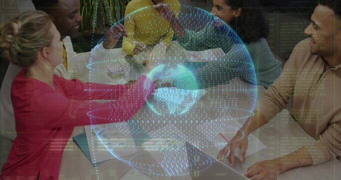 Collaborating 5 colleagues wearing business casual interacting in office with hologram globe, notes
