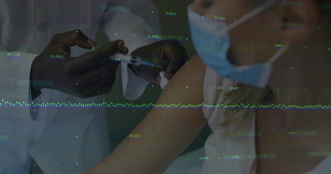Giving nurse inserting syringe into woman's arm at clinic, with white coat, mask and data overlay - Powered by Adobe