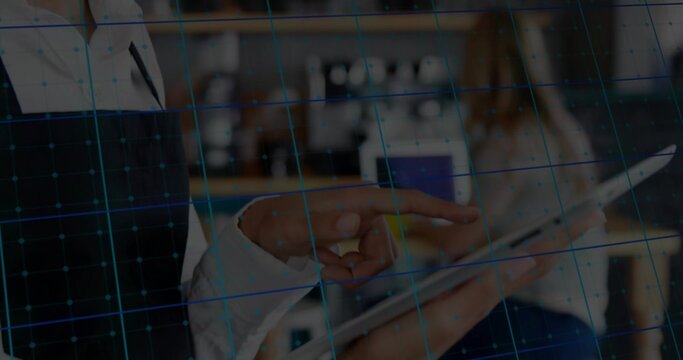 Pointing colleagues' hands in blazer and shirt using tablet at office counter, blue grid overlay - Powered by Adobe