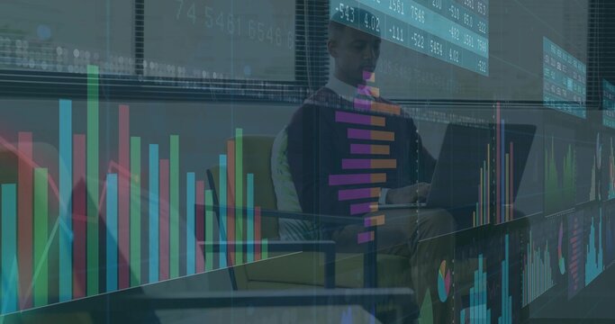 Sitting analyst wearing dark sweater, analyzing charts on laptop in office, copy space