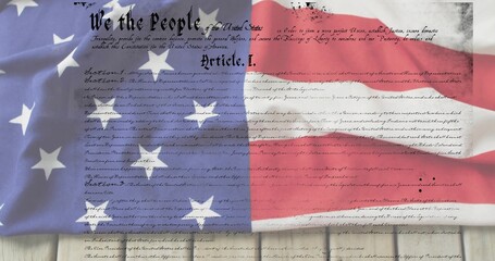 Obraz premium Draping United States flag revealing Constitution parchment on wooden planks, showing Article