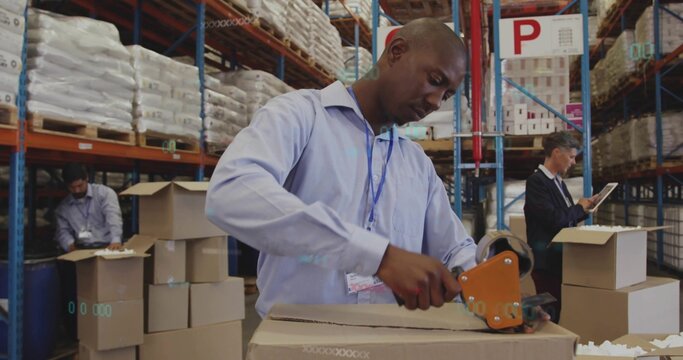 Sealing warehouse worker in shirt and badge sealing cardboard box at packing table with dispenser