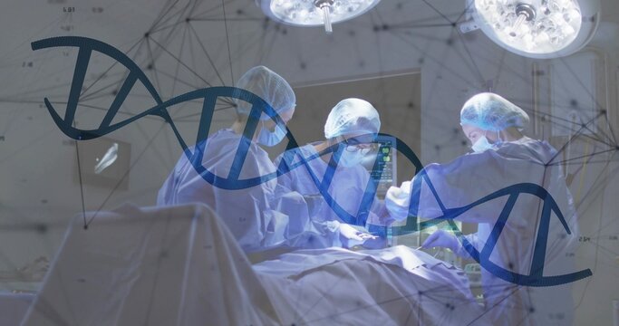 Performing surgical team wearing gowns, caps, masks operating in OR, with DNA overlay and monitor