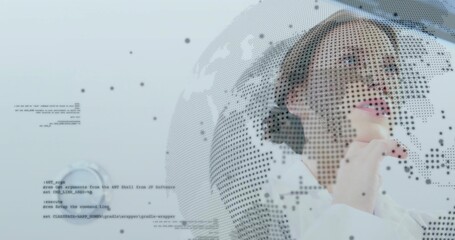 Thinking woman in white blouse holding chin, viewing dotted globe with code in studio, copy space