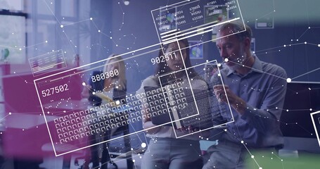 Collaborating team in business wear leaning over tablet with stylus in office showing numeric codes