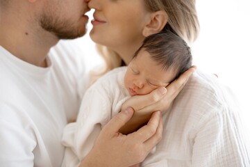 Loving Family Moment Newborn Baby in Parents Arms, a Portrait of Affection and Care