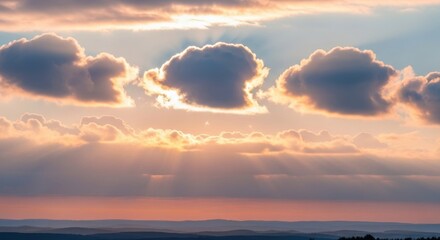 Bright sun rays bursting through dark clouds during a dramatic sunset
