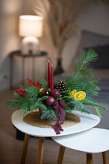 Christmas arrangements with candles and fir branches. Xmas decorations.