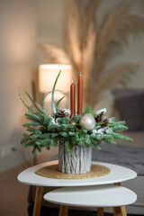 Winter Holiday Centerpiece With Pine Branches, Candles and Natural Decor