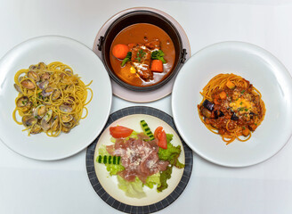 Enjoy a culinary journey with this appetizing Italian assortment. From savory pasta to a rich stew, it's a feast for the senses, perfect for any occasion.