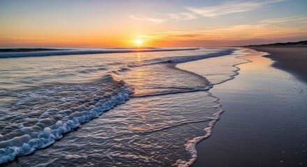 Gentle ocean waves washing over sandy beach 