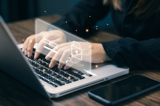 Hands typing on laptop with floating cybersecurity login interface, representing data protection, secure access, privacy encryption, and modern online security system for digital information safety.