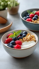 Yogurt bowl with berries, granola, and mint