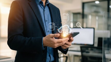 Businessman manages digital files using cloud computing and mobile device technology in the workplace