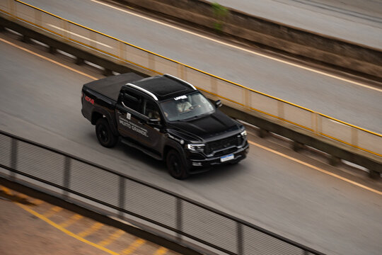 Black Foton Tunland front view three quarters, Pickup truck driving on highway