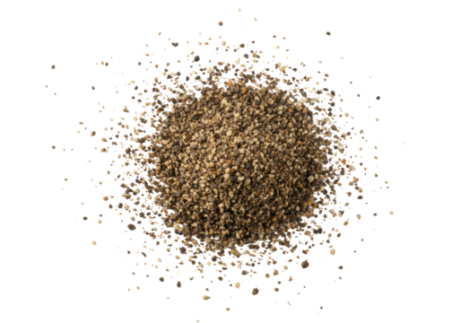 Extreme close-up macro of dark black and warm brown ground pepper particles, irregularly scattered on a pristine transparent background with copy space for text overlay, culinary ingredient concept