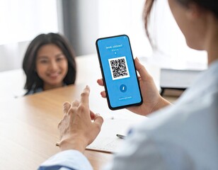 Woman Showing QR Code on Smartphone to Colleague