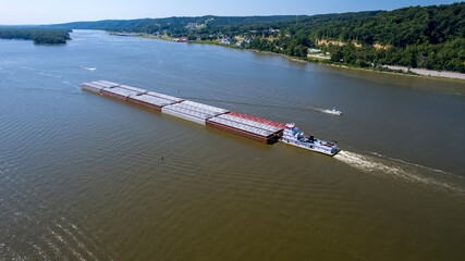 Obraz premium Aerial Journey of a Cargo Barge Along the Mighty Mississippi River